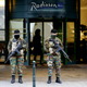 Belgian soldiers stand guard outside the Radisson Blu hotel in central Brussels, November 21, 2015, after security was tightened in Belgium following the fatal attacks in Paris. Belgium raised the alert status for its capital Brussels to the highest level on Saturday, shutting the metro and warning the public to avoid crowds because of a "serious and imminent" threat of an attack.